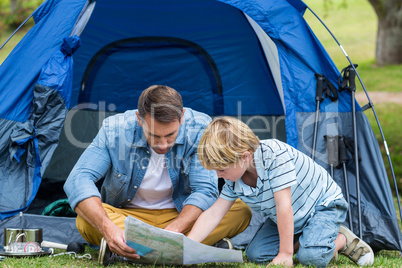 Father and son camping and looking for their way home