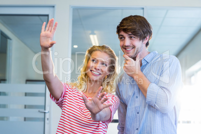 Pretty businesswoman doing frame with her hands and showing to h