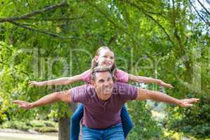 Father and daughter having fun in the park