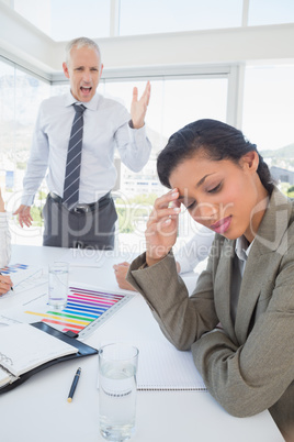 Businessman yelling at his colleague