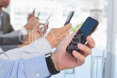 Business team using their mobile phone