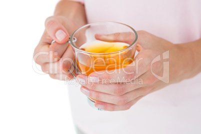 Woman holding glass of tea