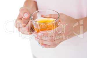 Woman holding glass of tea