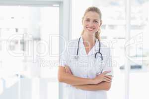 Confident female doctor smiling at camera