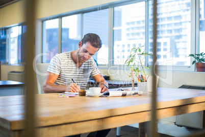 Casual businessman working at his desk