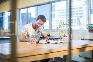 Casual businessman working at his desk