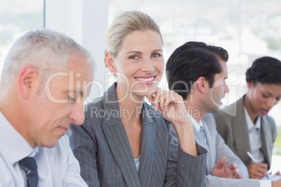 Business team taking notes during conference