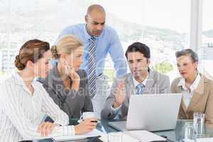 Business team working together on laptop