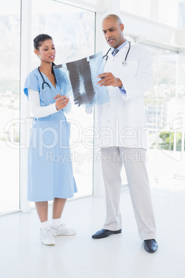 Doctors analyzing together xray