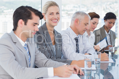 Business team taking notes during conference