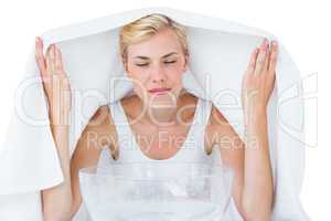 Blonde woman inhaling herbal medicine