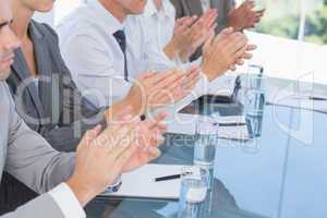 Business team applauding during conference