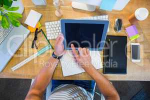 Casual businessman working on tablet