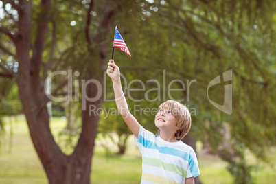 Young boy holding an american flag