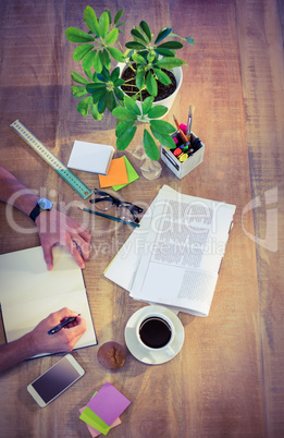 Designer working at desk overhead shot