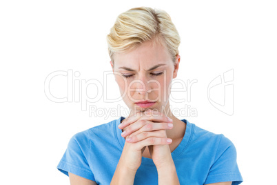 Pretty blond woman praying