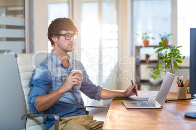 Focused businessman using digitizer