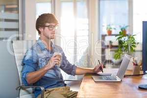 Focused businessman using digitizer