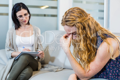 Psychologist talking with her depressed patient