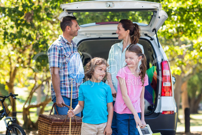 Happy family getting ready for road trip