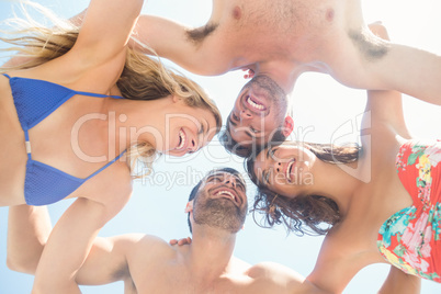 group of friends in swimsuits taking a selfie