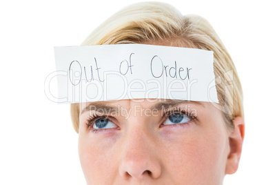 Anxious blonde woman with sign on her forehead