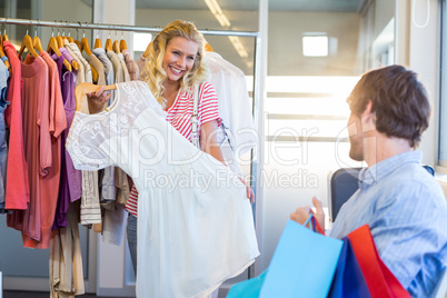 Happy blonde woman doing shopping with her boyfriend