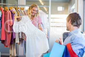 Happy blonde woman doing shopping with her boyfriend