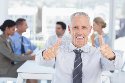 Smiling businessman and his team