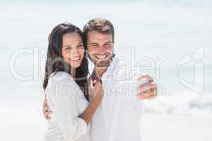 happy couple taking selfie