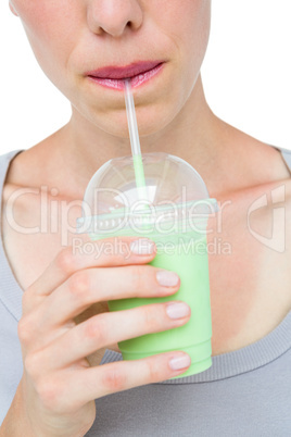 Attractive woman drinking healthy juice