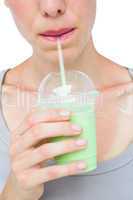 Attractive woman drinking healthy juice
