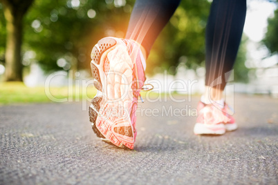 Highlighted foot bones of jogging woman