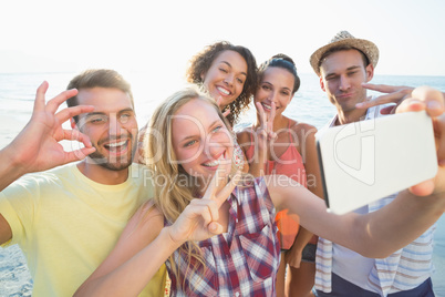 group of friends taking selfies