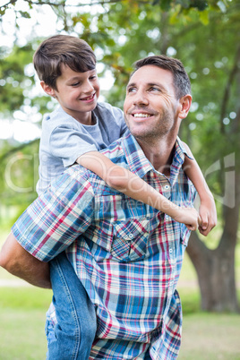 Father and son having fun in the park