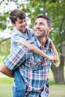 Father and son having fun in the park