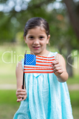 Little girl waving american flag