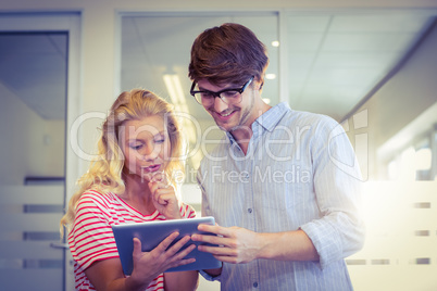 Colleagues looking at tablet pc together