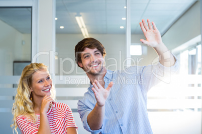 Handsome businessman doing frame with his hands and showing to h