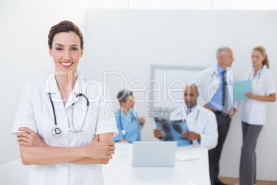 Smiling doctor looking at camera