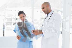 Doctors analyzing together xray