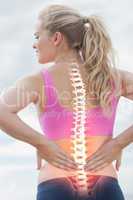 Highlighted spine of woman with back pain