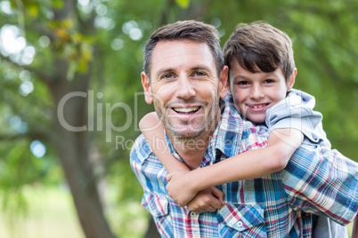 Father and son having fun in the park