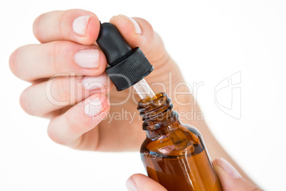 Woman holding bottle of medicine Woman holding bottle of medicine