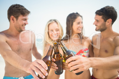 group of friends in swimsuits taking a selfie