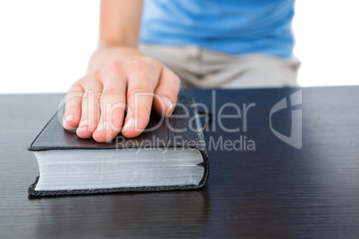 Woman praying with bible