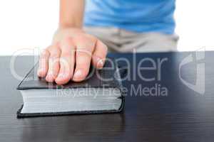 Woman praying with bible