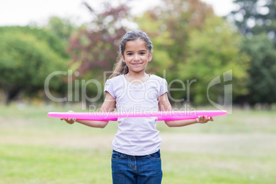 happy girl playing with hula hoops