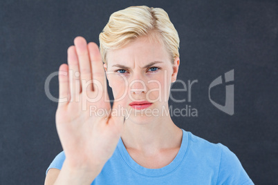 Stern woman gesturing with her hand