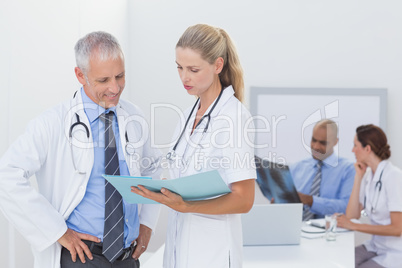 Team of doctors working on their files